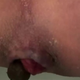 A short rear-view close-up of Nazzy over the toilet as she pushes out a firm turd into the bowl. Presented in 720P vertical HD format. About half a minute.